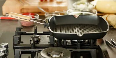 Empty clean griddle on gas stove