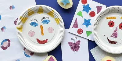 Potato printed red hearts on white paper